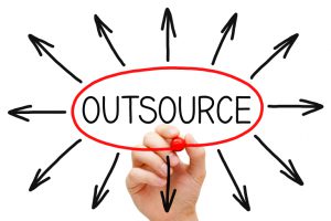Hand drawing Outsourcing concept with red marker on transparent wipe board.